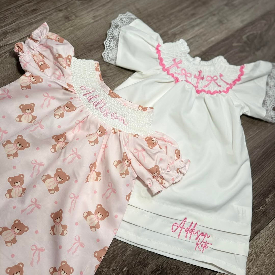 Two baby outfits with embroidered Addison Kate on them